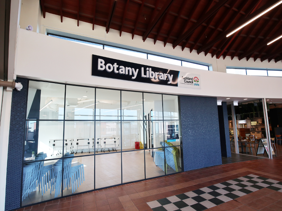 Library shopfront entrance inside a mall with large glazed facade