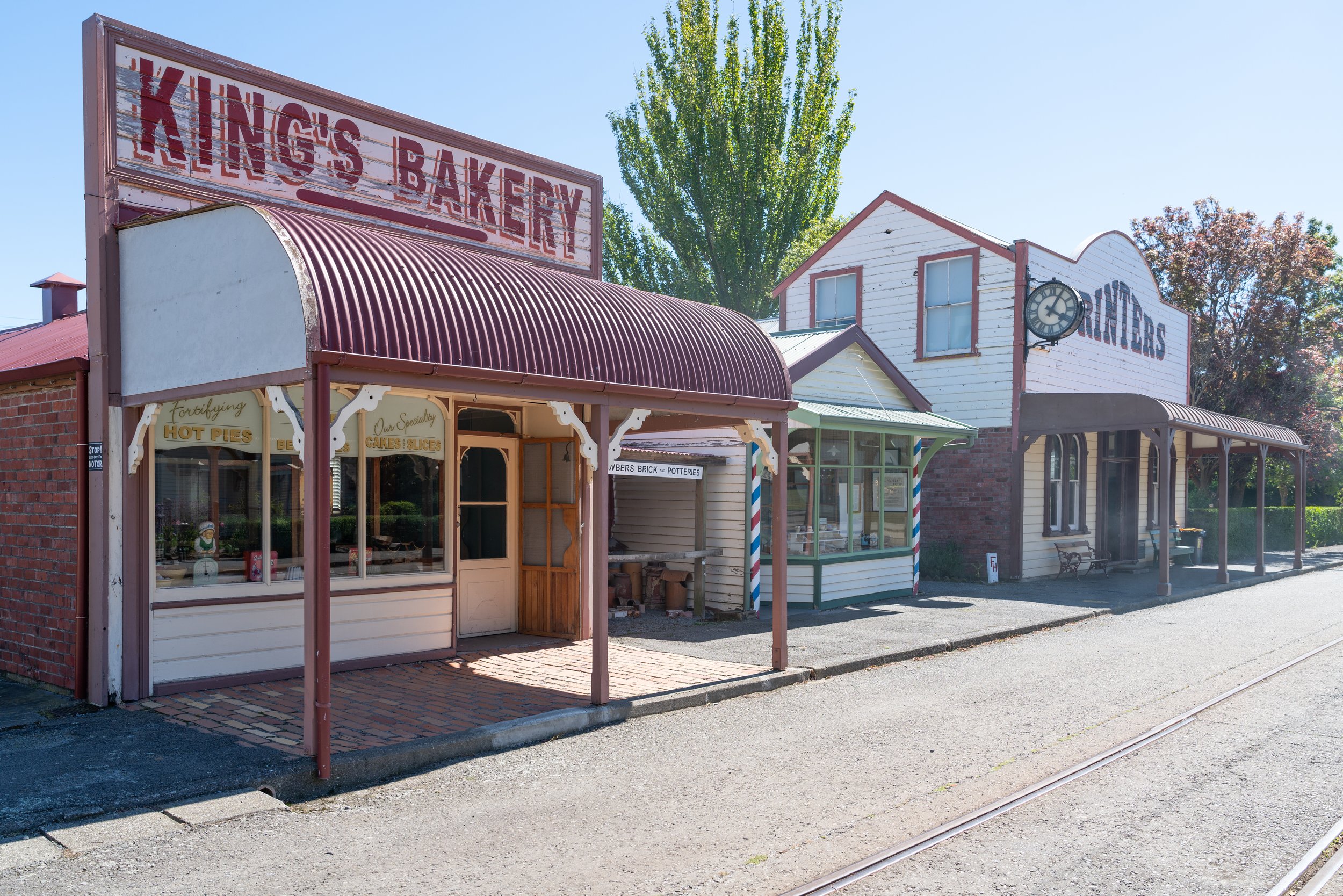 Heritage village streetscape with King's Bakery and Printers shopfronts