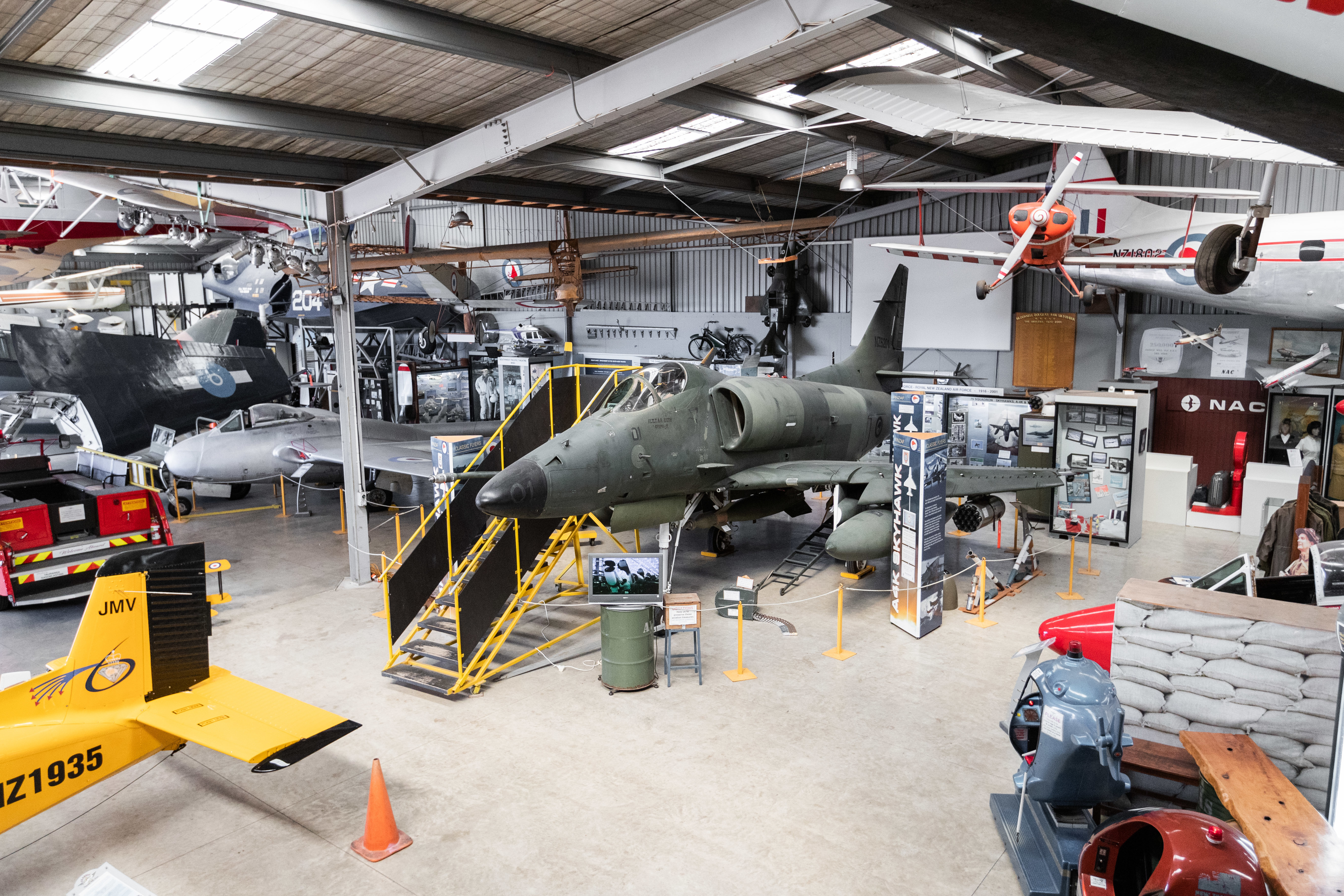 Aviation museum hangar with vintage aircraft and displays