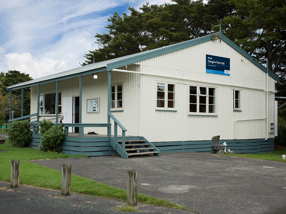 White weatherboard community hall with covered entrance steps