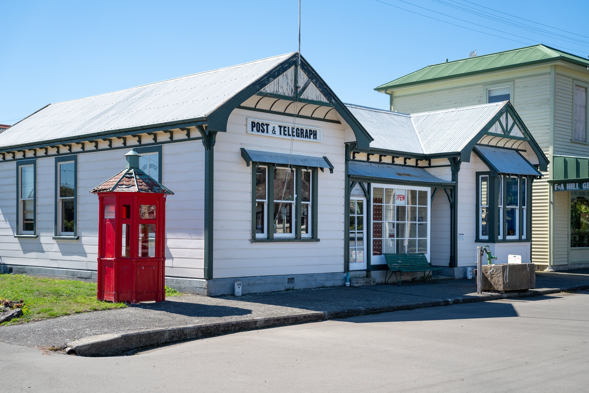 Heritage Post and Telegraph building with red telephone kiosk out front