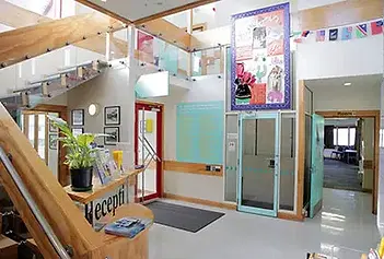 Community centre reception foyer with stairs and lift