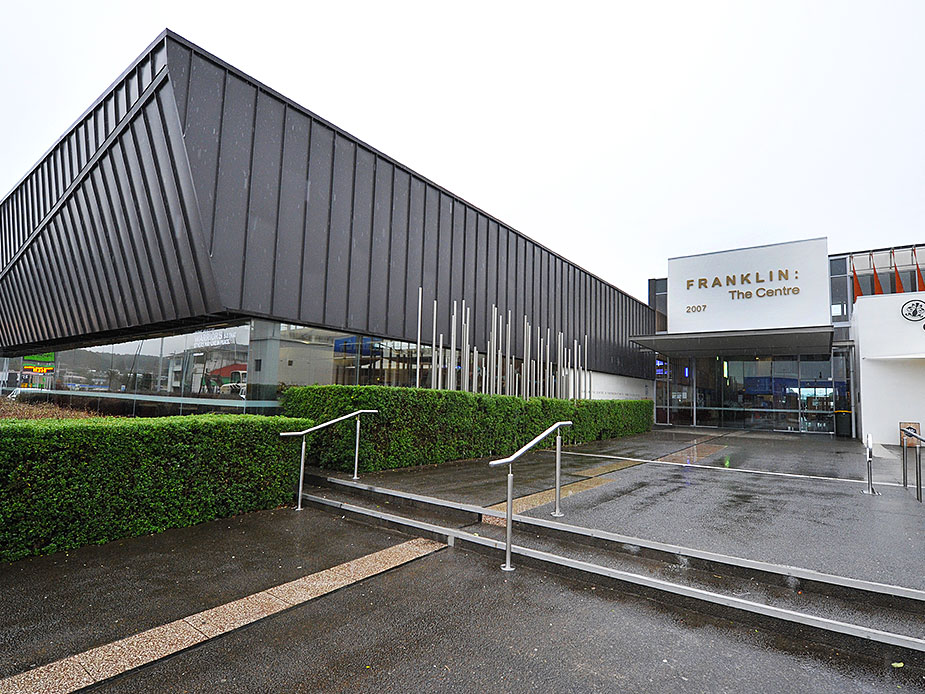 Franklin: The Centre building with angular dark metal cladding and glazed entry