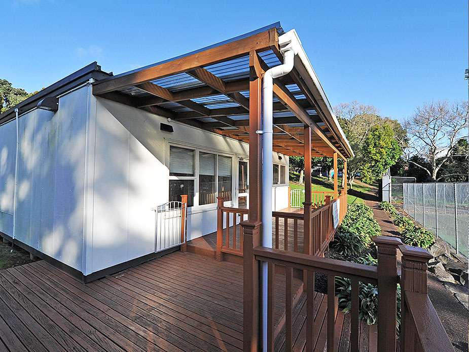 Side view of pavilion with timber deck and polycarbonate roof canopy