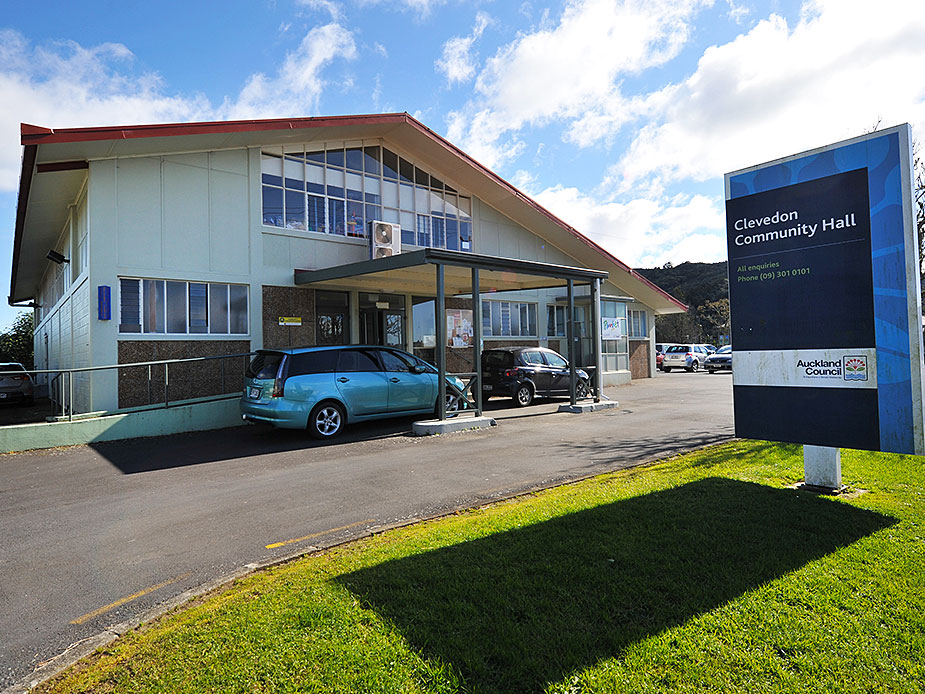 Clevedon Community Hall exterior with council signage and vehicles in carpark