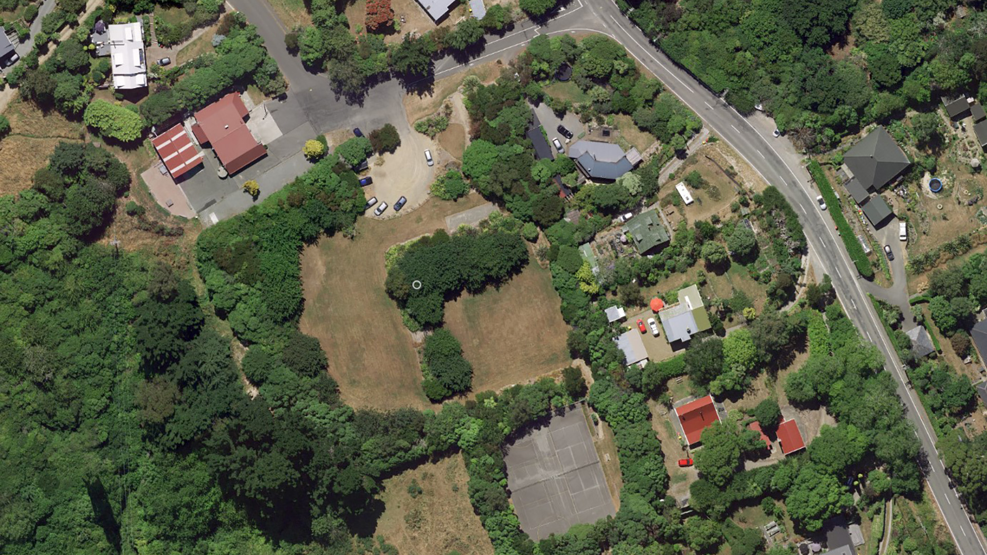 Aerial satellite view of reserve with buildings, parking and grounds