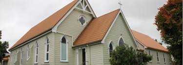 Small heritage church with arched windows and cross