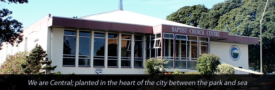 Single-storey church building with signage reading Baptist Church Centre and car park