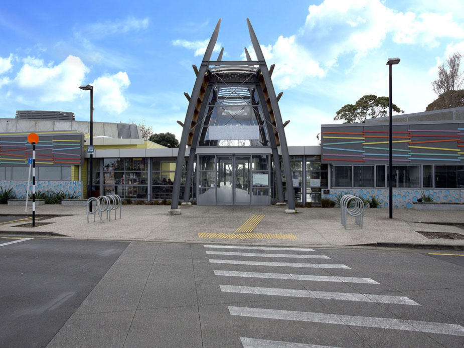 Arts centre with angular entry canopy and colourful facade panels