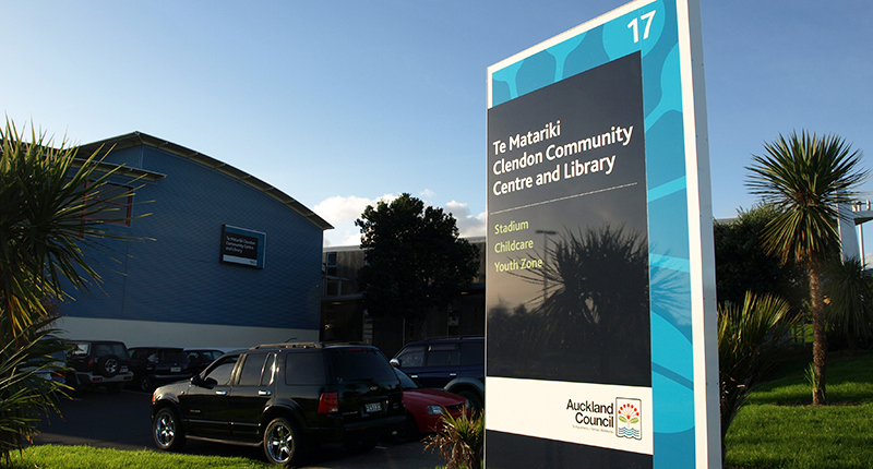 Community centre exterior with signage pylon in carpark