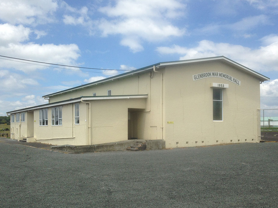 Cream rendered war memorial hall building with gable roof