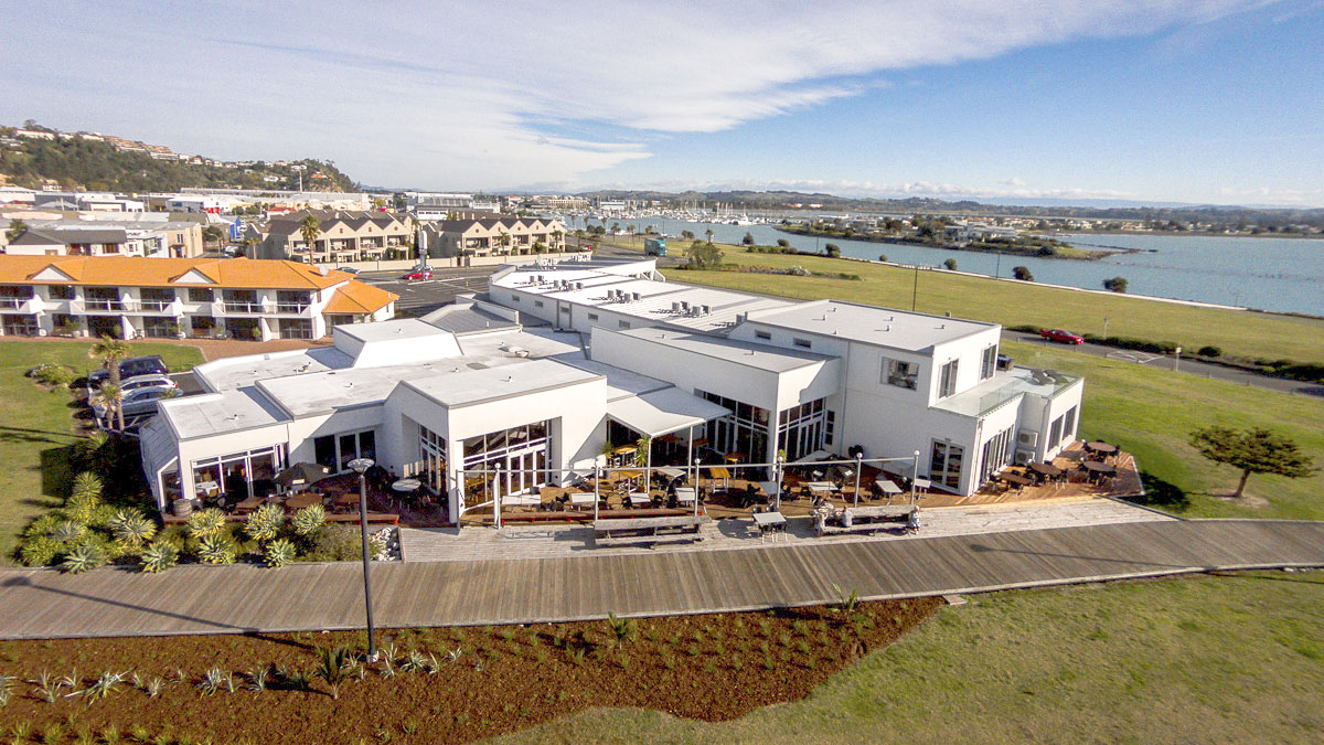 Aerial view of hotel complex near marina and bay