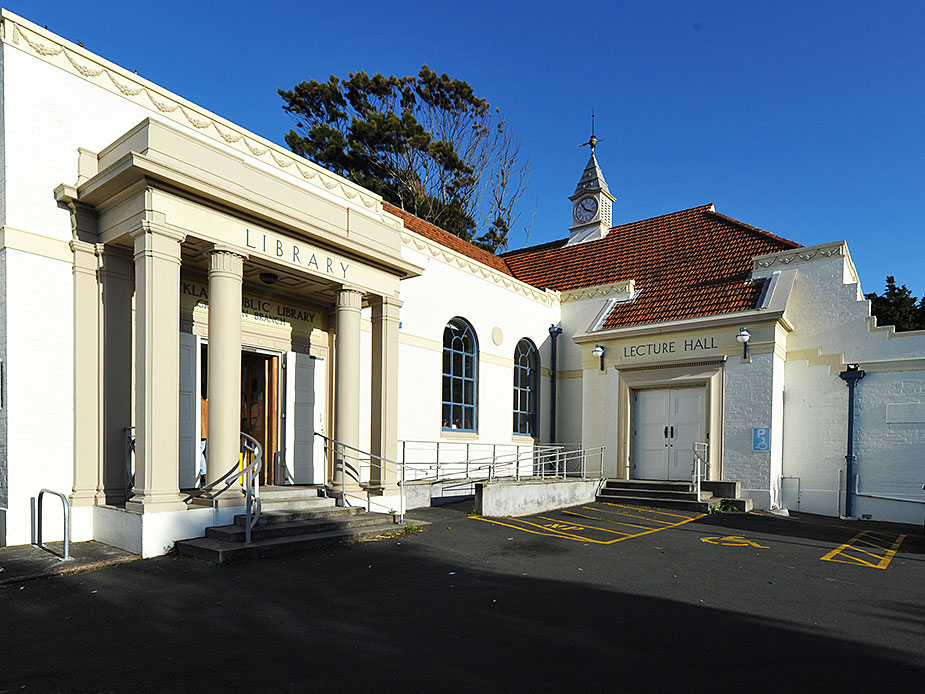 Heritage library and lecture hall building with classical columns and clock tower