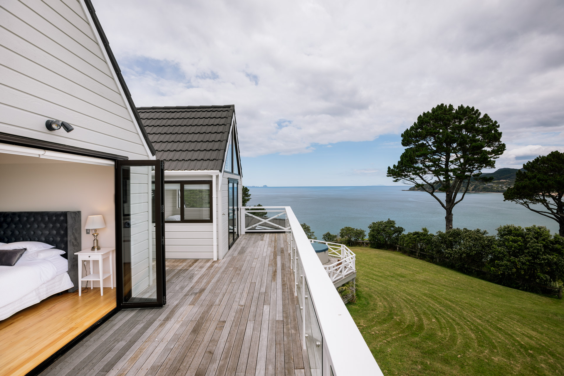 Accommodation deck and bedroom with a sea view and timber deck