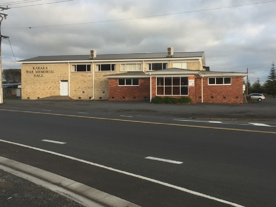 Two-storey brick war memorial hall building beside road