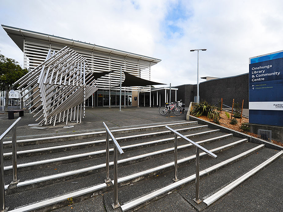 Modern community centre building with angular canopy and entrance steps