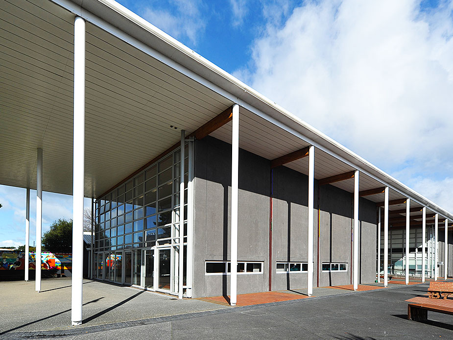 Front facade of community centre with colonnade and large glazed entrance
